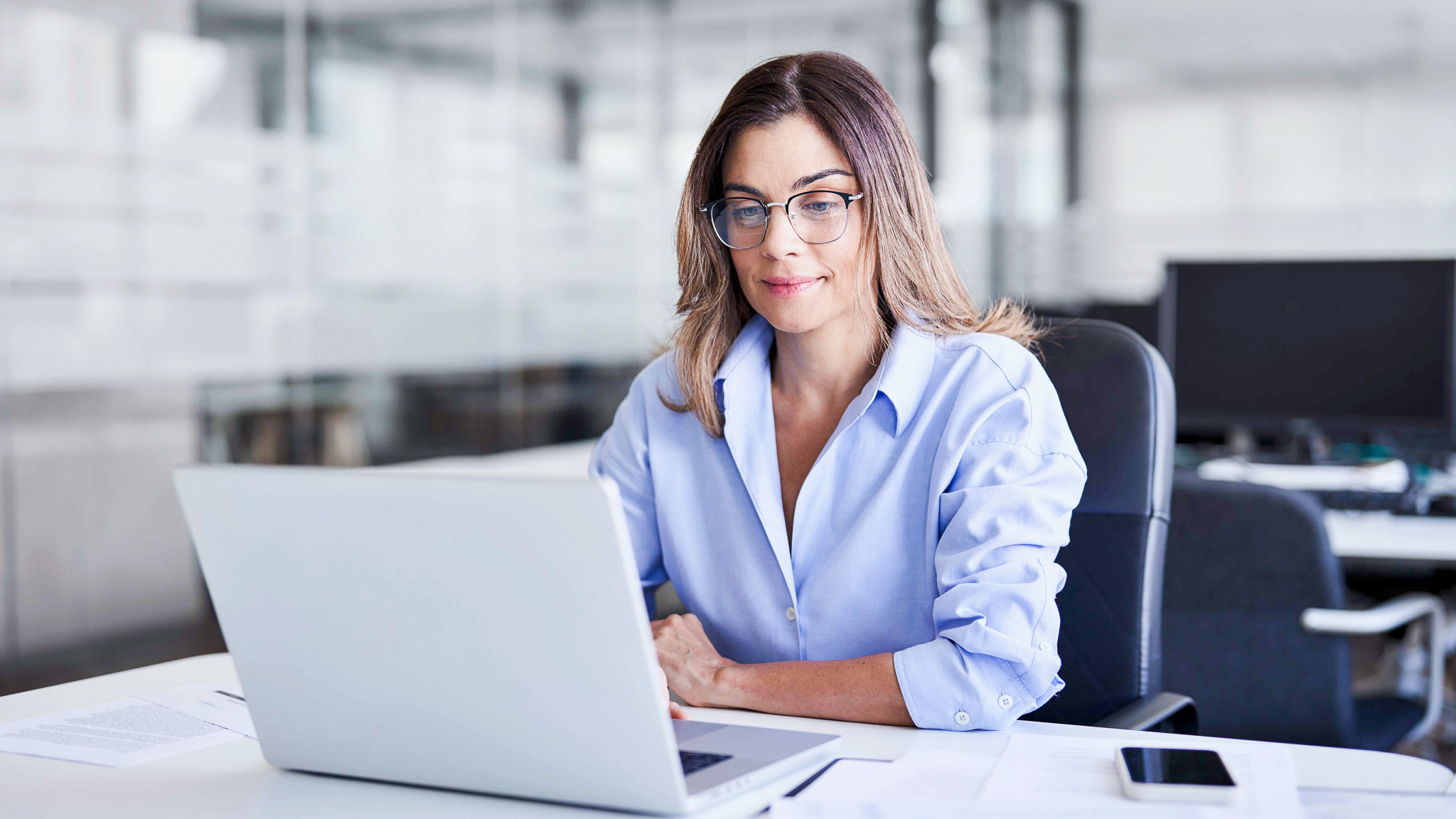 Woman sitting at her computer