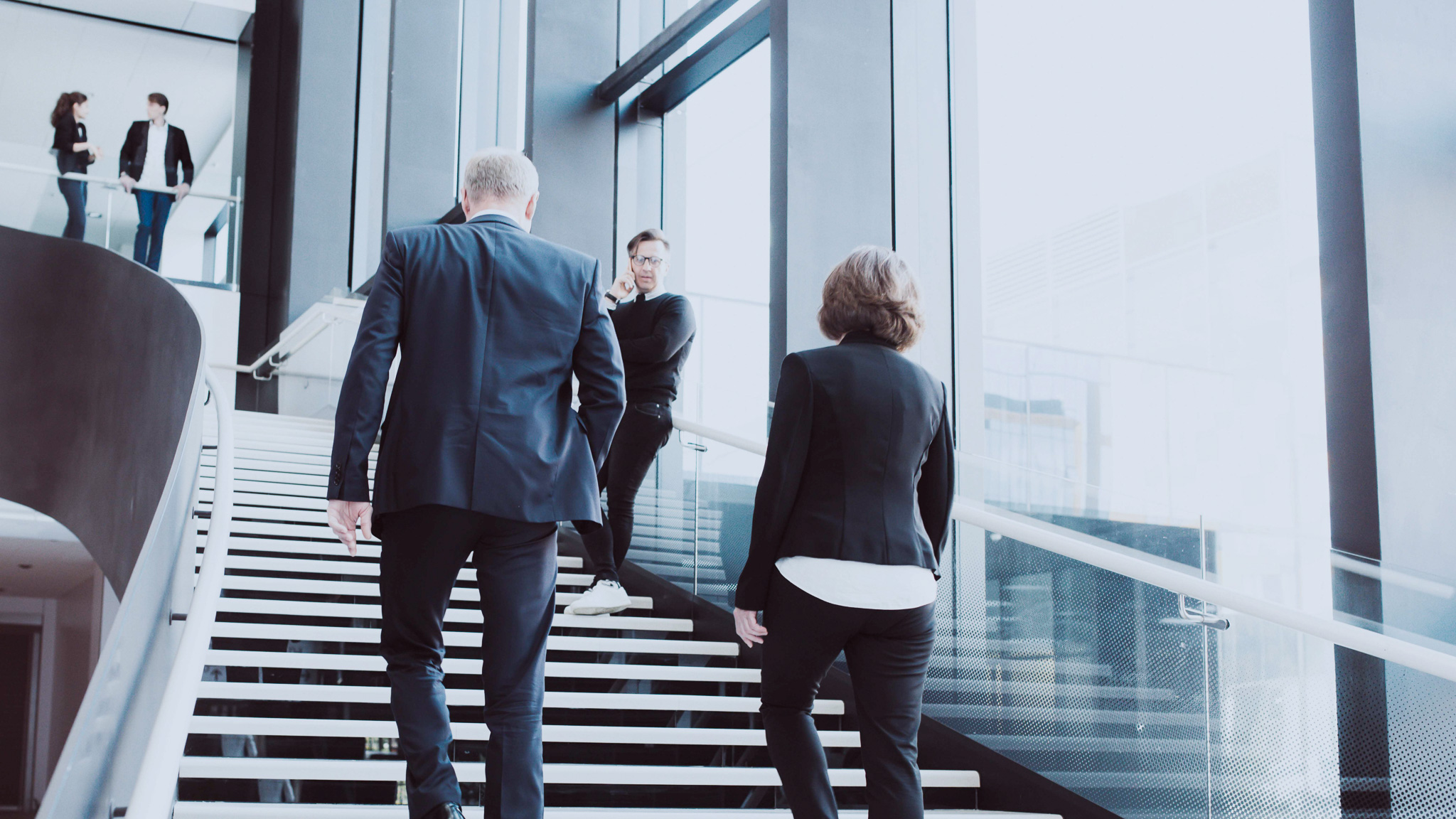 Business people wakling in stairs